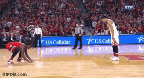 A Basketball Game Is Being Played In Front Of A Crowd With Us Cellular Advertisements GIF