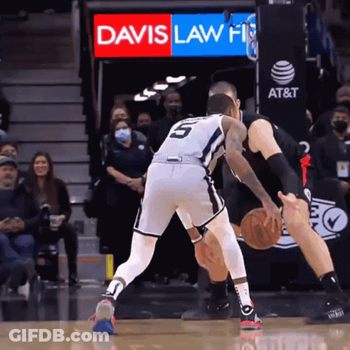 A Basketball Game Is Being Played In Front Of A Davis Law Firm Sign GIF