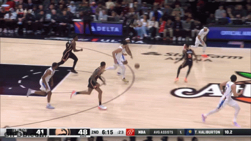 A Basketball Game Is Being Played In Front Of A Delta Banner GIF