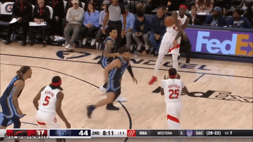 A Basketball Game Is Being Played In Front Of A Fedex Banner GIF