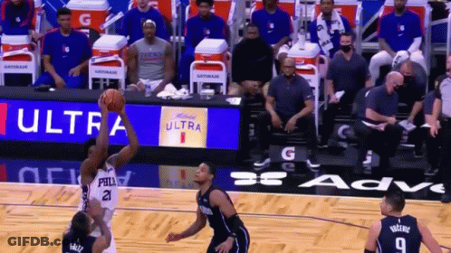 A Basketball Game Is Being Played In Front Of A Gatorade Banner GIF