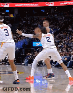 A Basketball Game Is Being Played In Front Of A Hometown Banner GIF