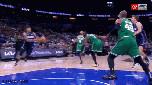 A Basketball Game Is Being Played In Front Of A Kia Advertisement GIF