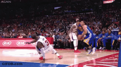 A Basketball Game Is Being Played In Front Of A Kia Sign GIF
