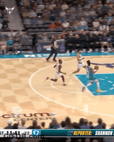 A Basketball Game Is Being Played In Front Of A Large Crowd GIF