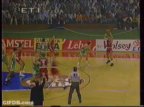 A Basketball Game Is Being Played In Front Of A Large Crowd With Ads For Amstel And Wolsey GIF