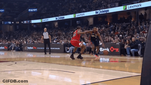 A Basketball Game Is Being Played In Front Of A Lexmark Advertisement GIF