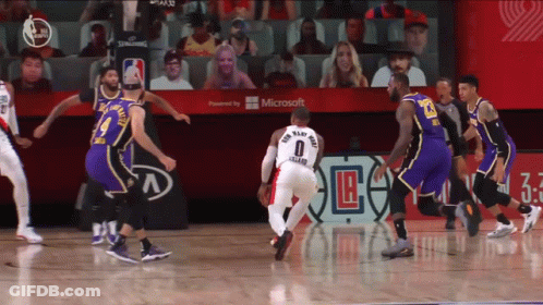 A Basketball Game Is Being Played In Front Of A Microsoft Banner GIF