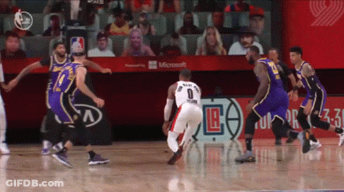 A Basketball Game Is Being Played In Front Of A Microsoft Banner GIF
