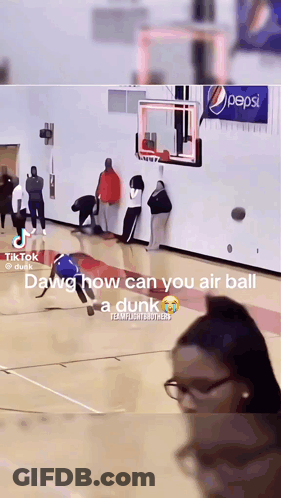 A Basketball Game Is Being Played In Front Of A Pepsi Ad GIF