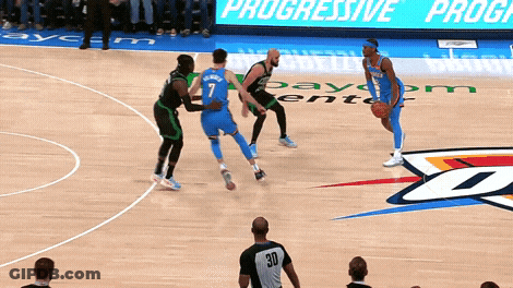 A Basketball Game Is Being Played In Front Of A Progressive Program Sign GIF