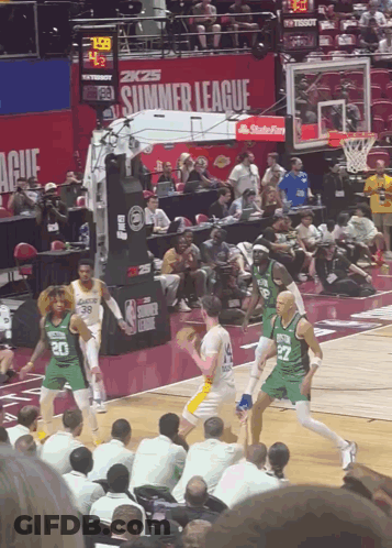 A Basketball Game Is Being Played In Front Of A Sign That Says 2K25 Summer League GIF
