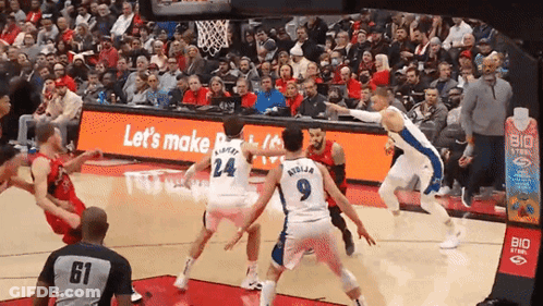 A Basketball Game Is Being Played In Front Of A Sign That Says " Let 'S Make " GIF
