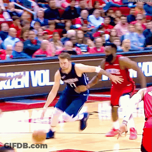 A Basketball Game Is Being Played In Front Of A Sign That Says ' Rzen Vol ' On It GIF