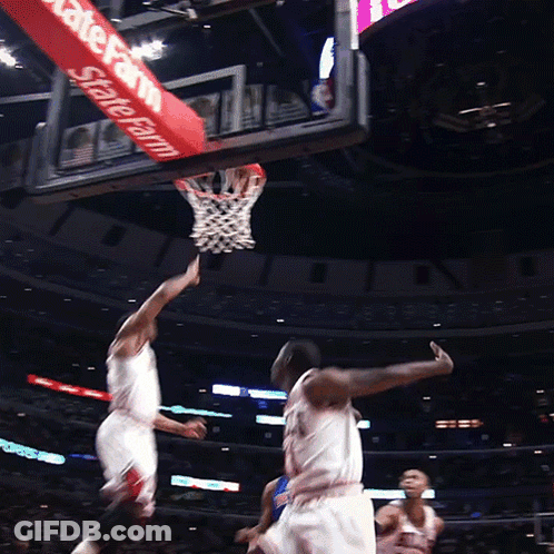 A Basketball Game Is Being Played In Front Of A Sign That Says State Farm GIF