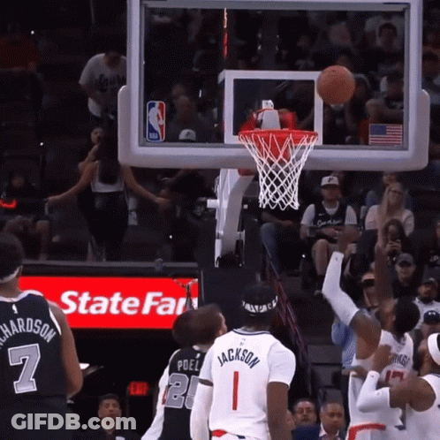 A Basketball Game Is Being Played In Front Of A State Farm Ad GIF