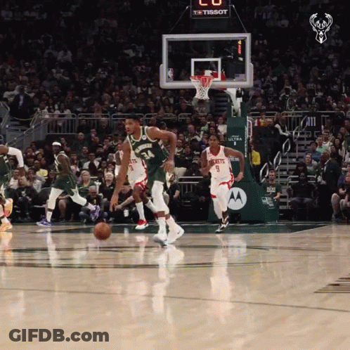 A Basketball Game Is Being Played In Front Of A Tissot Banner GIF