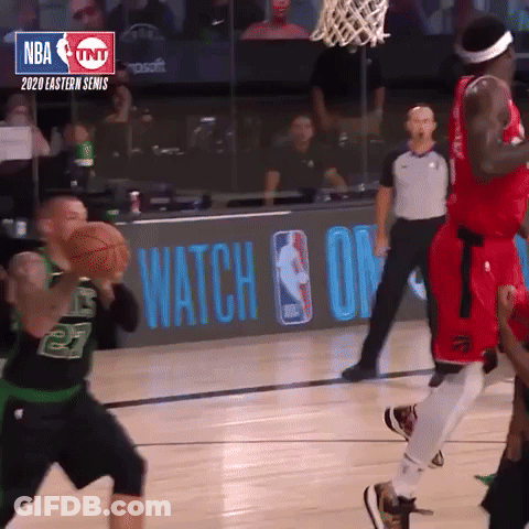 A Basketball Game Is Being Played In Front Of A Tnt Sign GIF