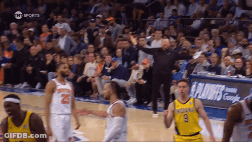 A Basketball Game Is Being Played In Front Of A Tnt Sports Banner GIF