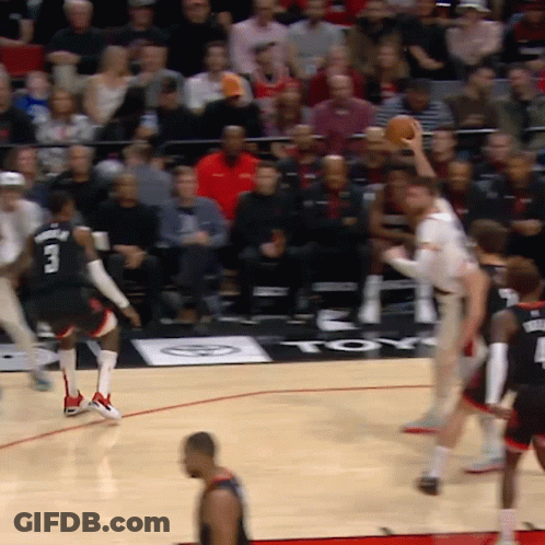 A Basketball Game Is Being Played In Front Of A Toyota Sign GIF