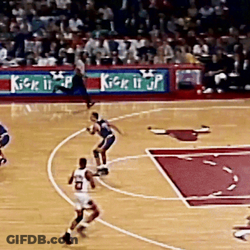 A Basketball Game Is Being Played In Front Of An Ad For Kick It Jp GIF