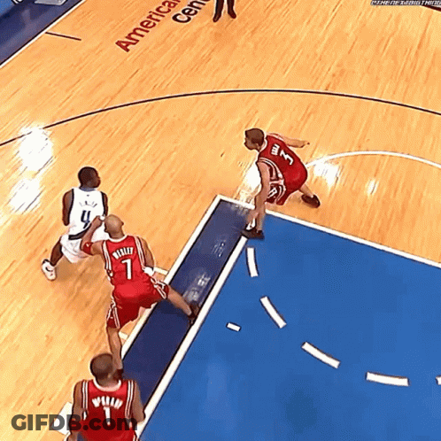 A Basketball Game Is Being Played In The America Center GIF