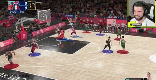 A Basketball Game Is Being Played On A Computer Screen With A Crowd Watching . GIF