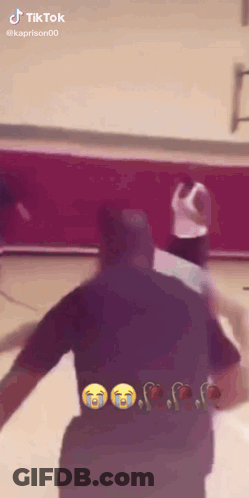 A Basketball Game Is Being Played On A Court And A Man Is Crying . GIF