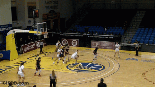 A Basketball Game Is Being Played On A Court Sponsored By Qualtrics GIF