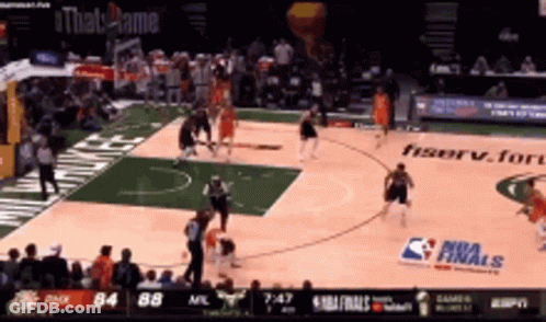 A Basketball Game Is Being Played On A Court That Has A Nba Finals Sign On It GIF