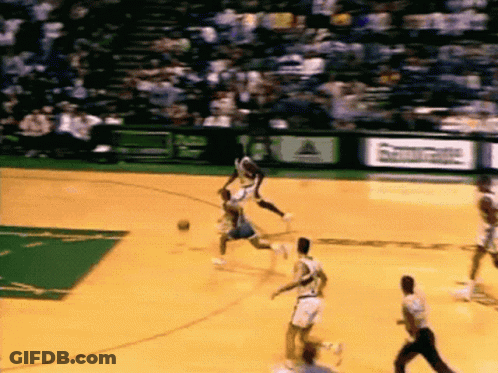 A Basketball Game Is Being Played On A Court That Has A Sign That Says ' Reebok ' On It GIF