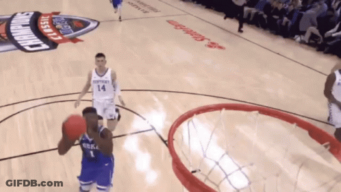 A Basketball Game Is Being Played On A Court That Has Kentucky Classic Written On It GIF