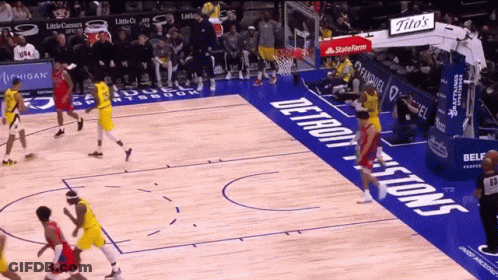 A Basketball Game Is Being Played On A Court That Has The Word Detroit On It GIF