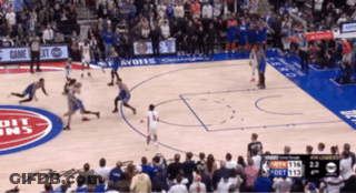 A Basketball Game Is Being Played On A Court That Has The Word Detroit On The Floor GIF
