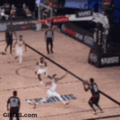 A Basketball Game Is Being Played On A Court That Has The Word Spurs On The Floor GIF