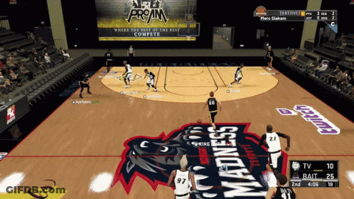 A Basketball Game Is Being Played On A Court That Says Madness On The Floor GIF