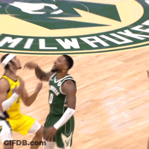 A Basketball Game Is Being Played On A Court That Says Milwaukee On It GIF