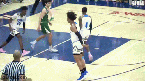 A Basketball Game Is Being Played On A Court That Says Slam GIF