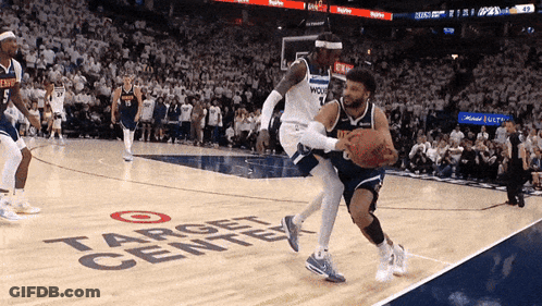 A Basketball Game Is Being Played On A Court That Says Target Center GIF