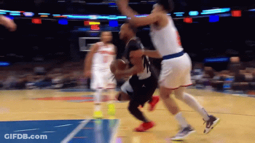 A Basketball Game Is Being Played On A Court With A Blue Line GIF