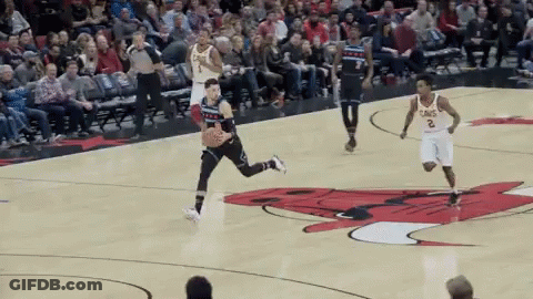 A Basketball Game Is Being Played On A Court With A Bull On The Court GIF