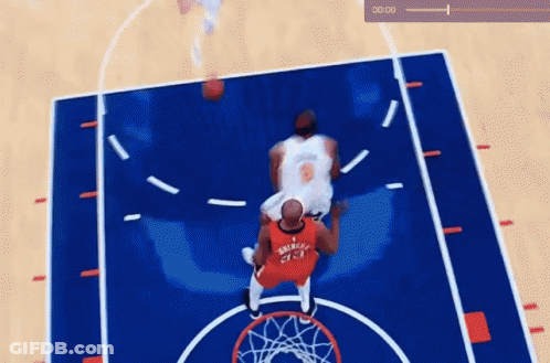A Basketball Game Is Being Played On A Court With A Clock Showing 0:01 GIF