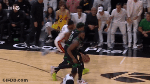 A Basketball Game Is Being Played On A Court With A Pixel Logo On The Floor GIF