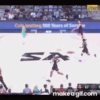 A Basketball Game Is Being Played On A Court With A Sa Logo On It GIF