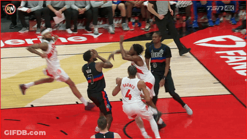 A Basketball Game Is Being Played On A Court With A Sign That Says Fan On It GIF