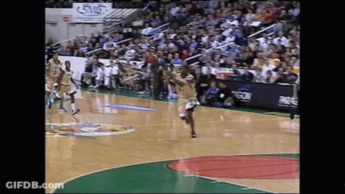 A Basketball Game Is Being Played On A Court With A Sign That Says Swg GIF