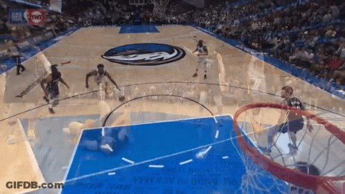 A Basketball Game Is Being Played On A Court With A Tnt Ad GIF