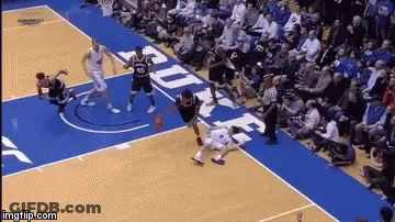 A Basketball Game Is Being Played On A Court With Duke Written On It GIF