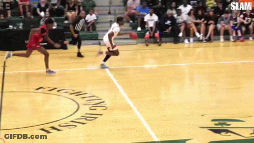 A Basketball Game Is Being Played On A Court With Fighting Irish Written On The Floor GIF
