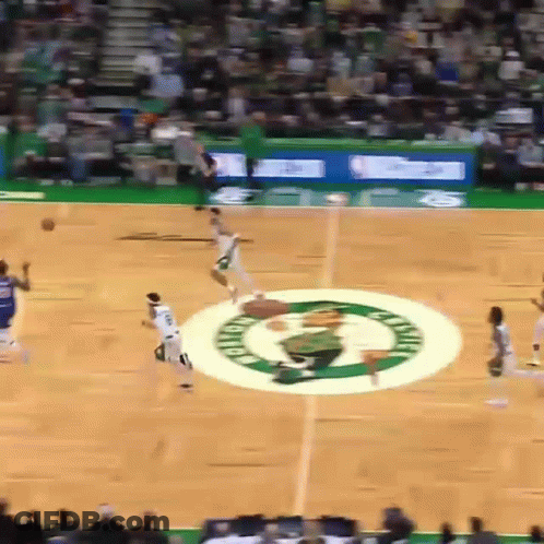 A Basketball Game Is Being Played On A Court With The Celtics Logo In The Middle GIF